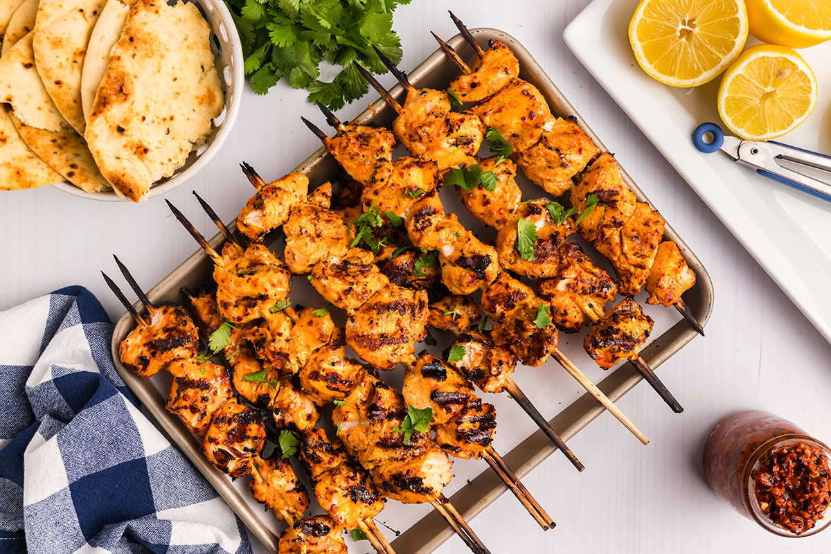 overhead shot of harissa chicken kabobs