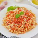 angled shot of bowl of pasta with pomodoro sauce