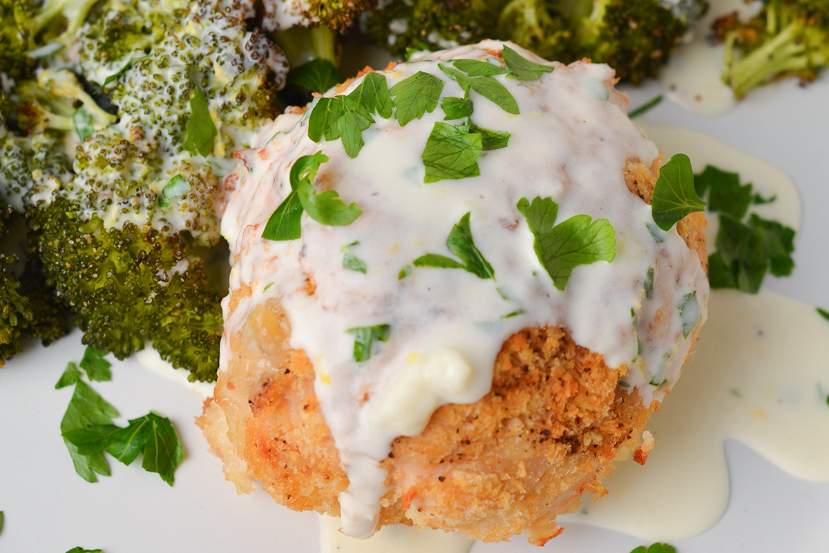 close up of chicken cordon bleu topped with creamy sauce