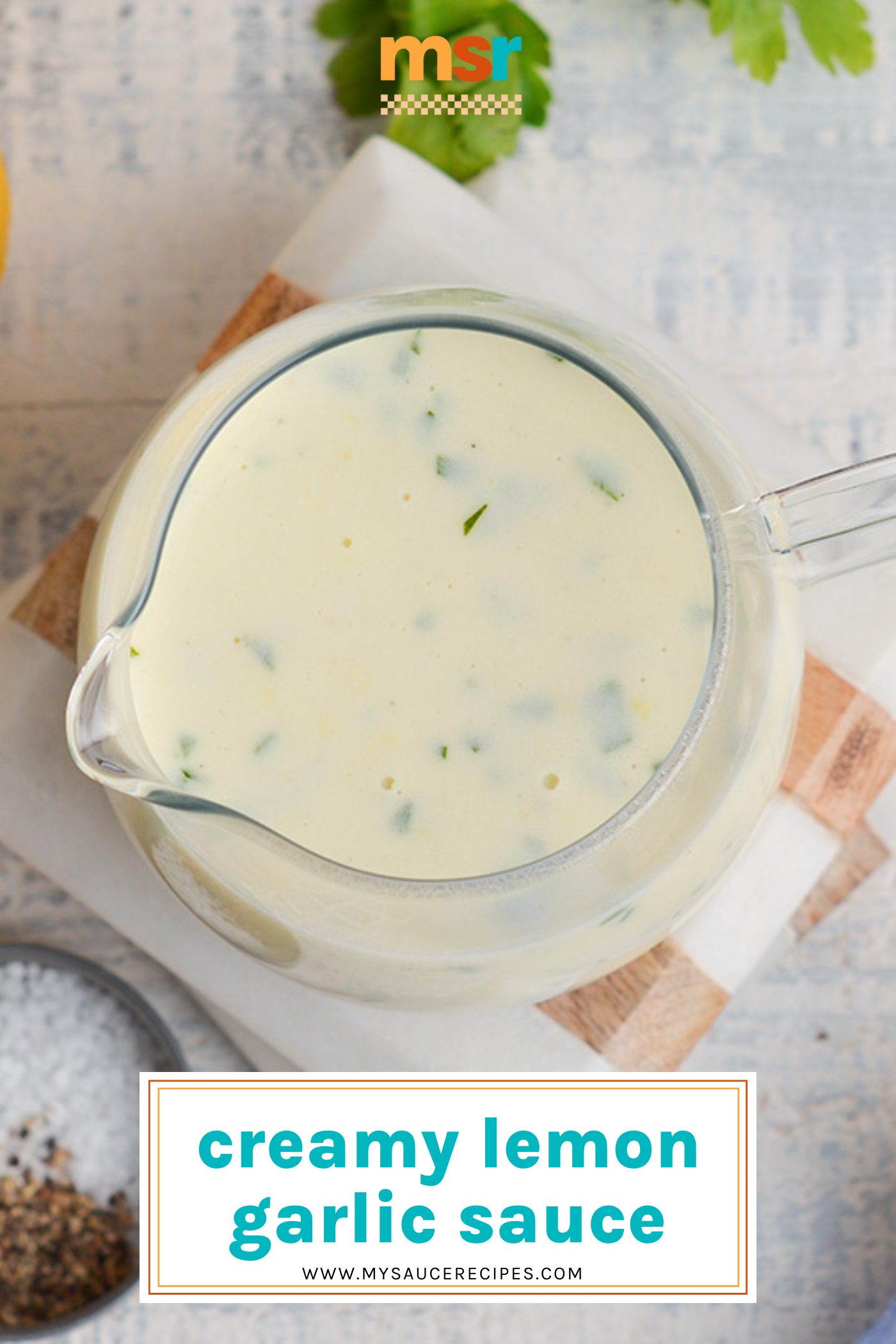 overhead shot of jar of lemon garlic cream sauce with text overlay