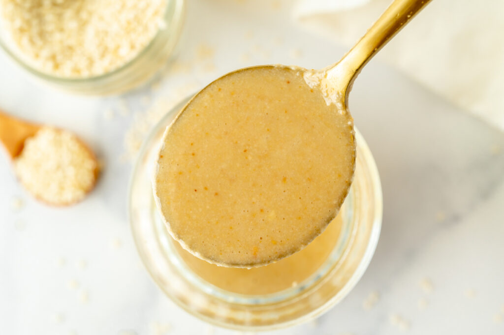 close up overhead shot of spoon full of tahini