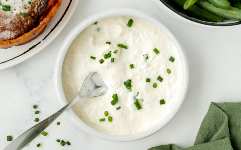 spoon in bowl of horseradish sauce