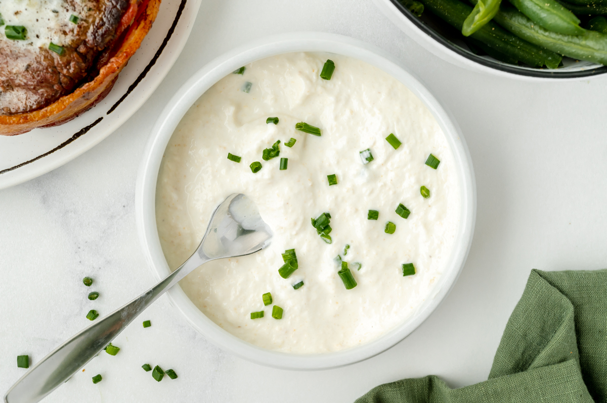 spoon in bowl of horseradish sauce