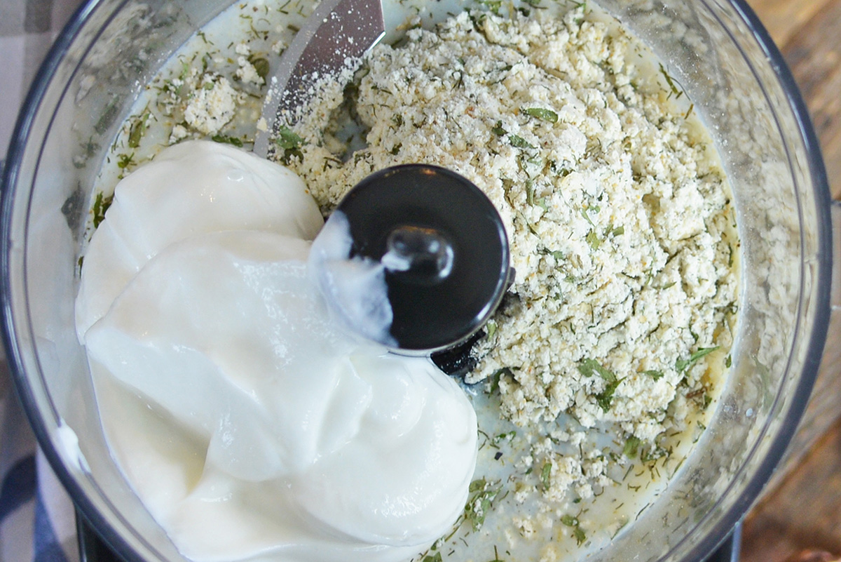 close up shot of homemade ranch ingredients in food processor