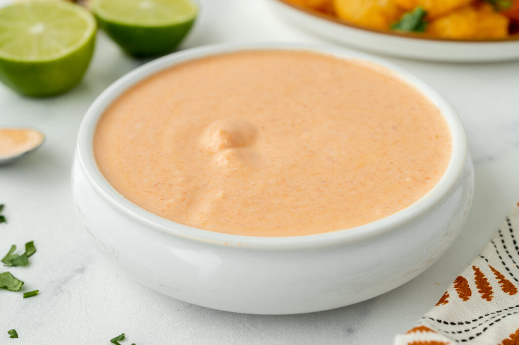 angled shot of bowl of red curry sauce