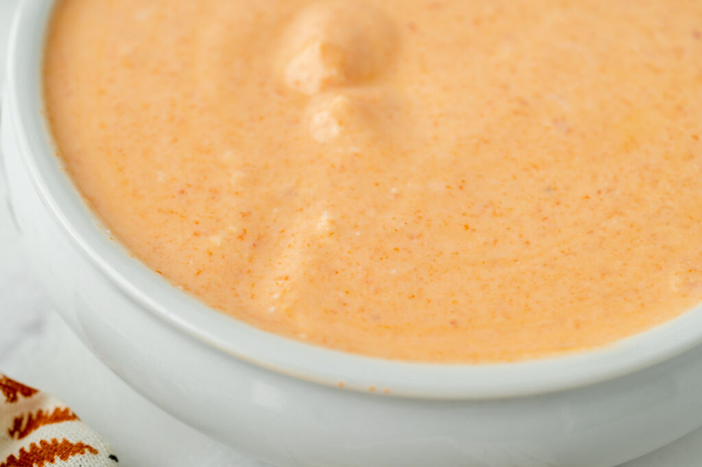 close up angled shot of bowl of sauce