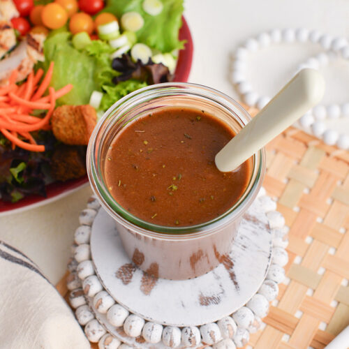 angled shot of jar of balsamic dressing