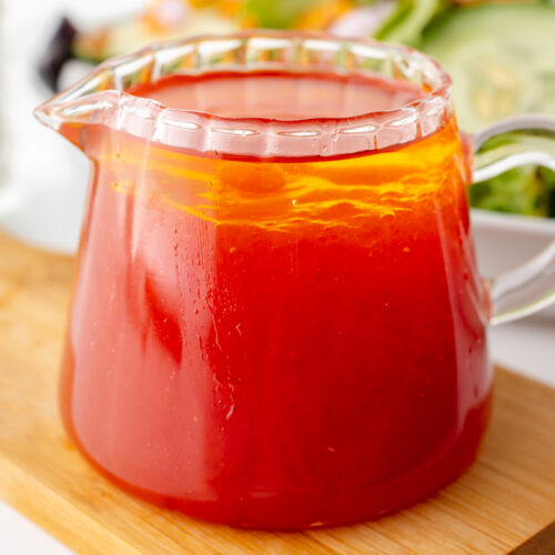 angled shot of salad dressing in jar