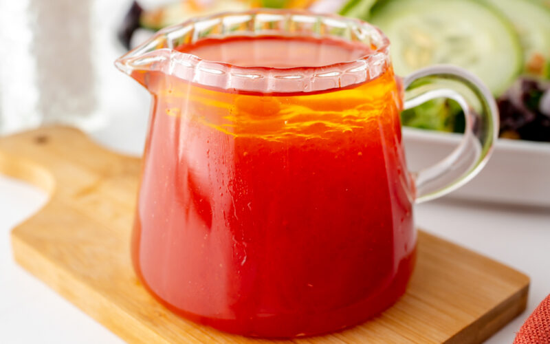 angled shot of salad dressing in jar