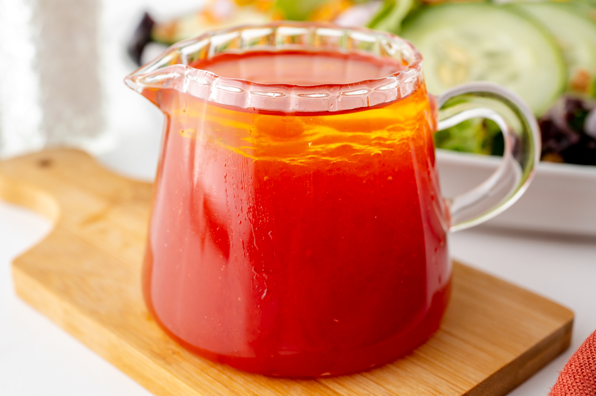 angled shot of salad dressing in jar