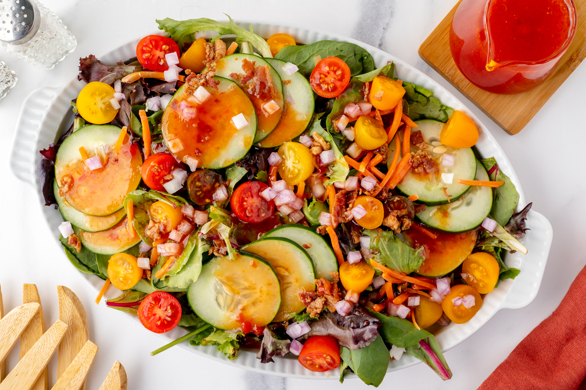 overhead shot of salad topped with dressing