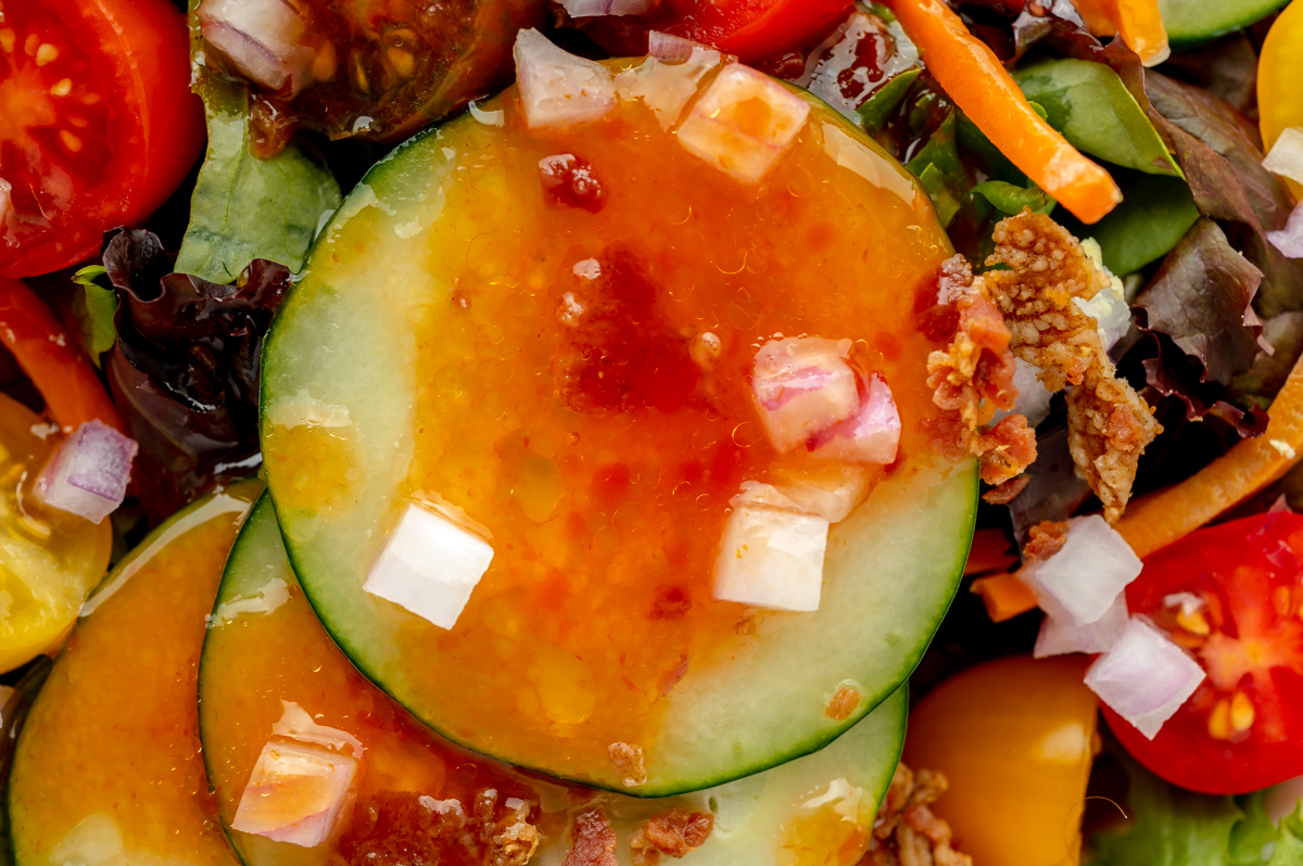 close up of french dressing on cucumber