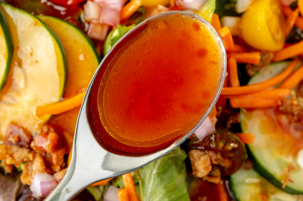 overhead shot of french dressing in spoon