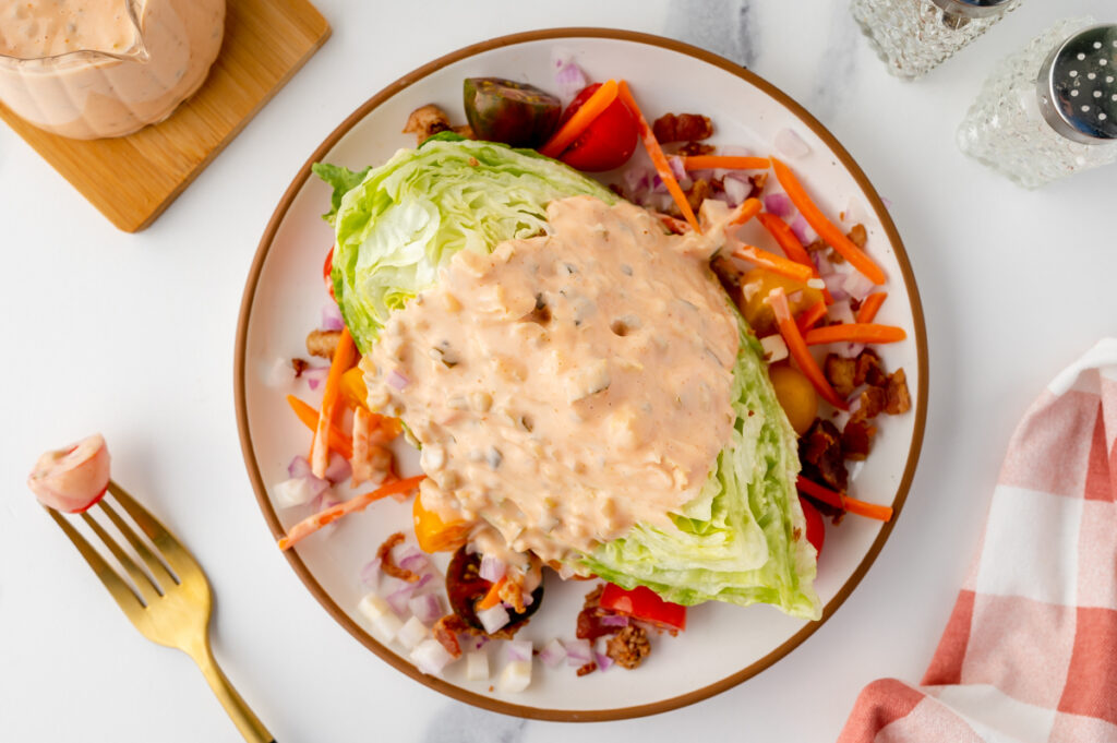 overhead shot of salad topped with thousand island dressing