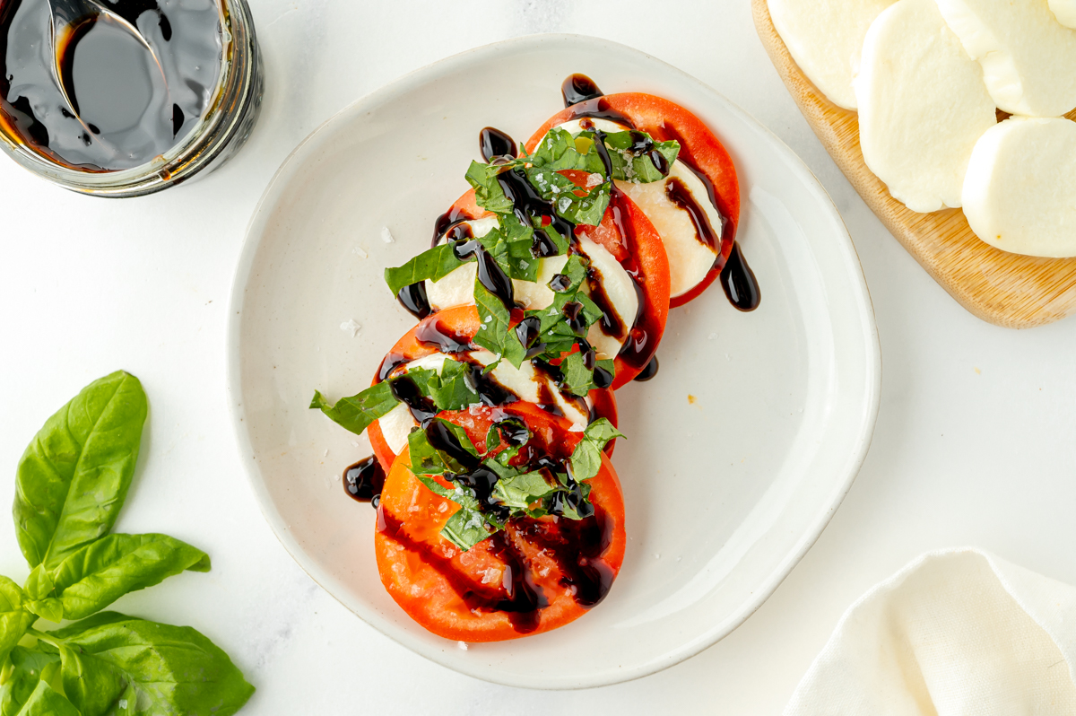 caprese salad topped with drizzle of balsamic glaze