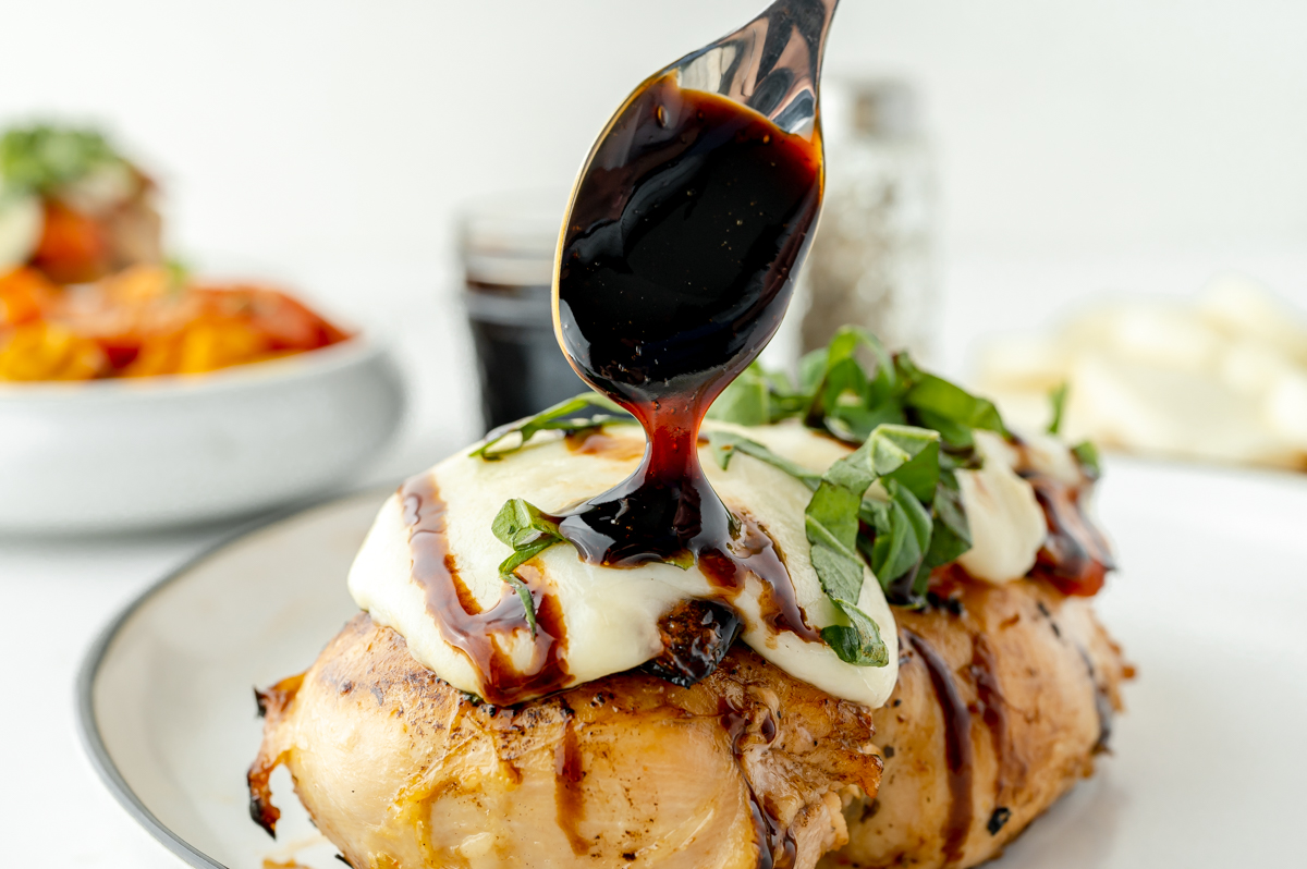 balsamic glaze drizzled over caprese chicken