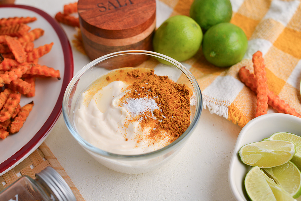 angled shot of curry mayo ingredients in bowl