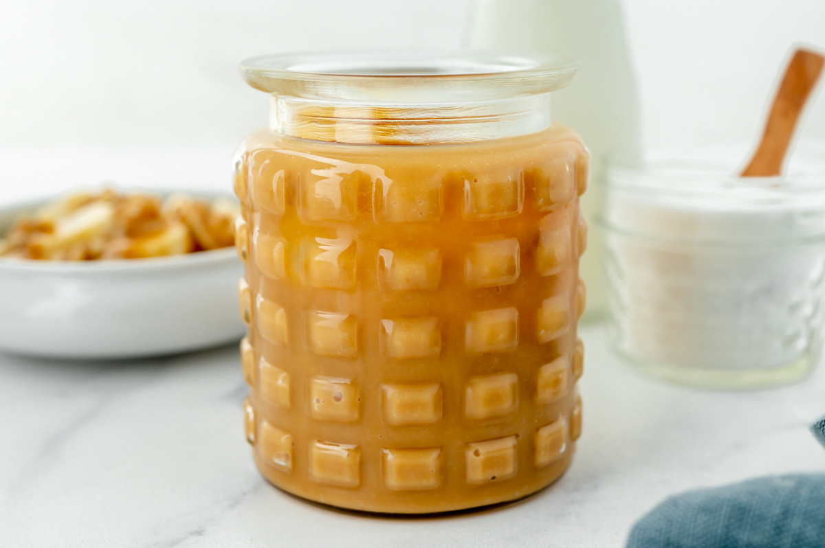 angled shot of jar of dulce de leche sauce