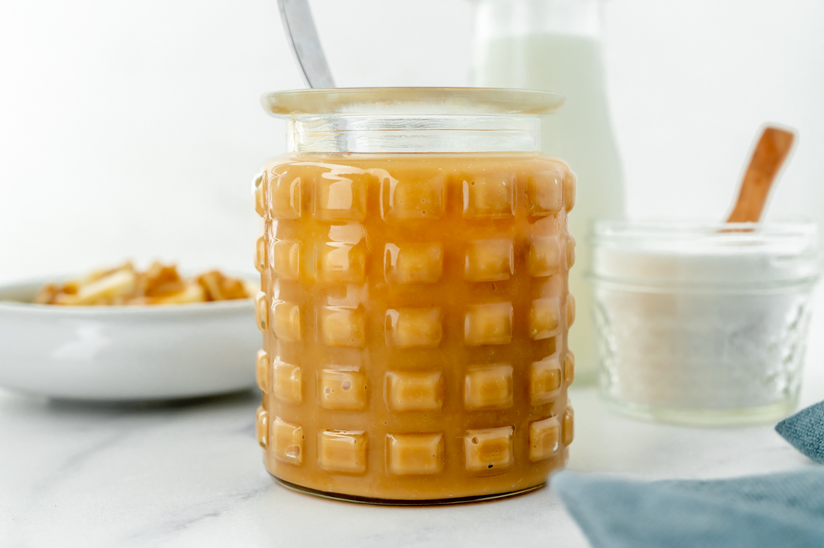 spoon in jar of dulce de leche