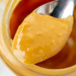 close up shot of spoon full of dulce de leche