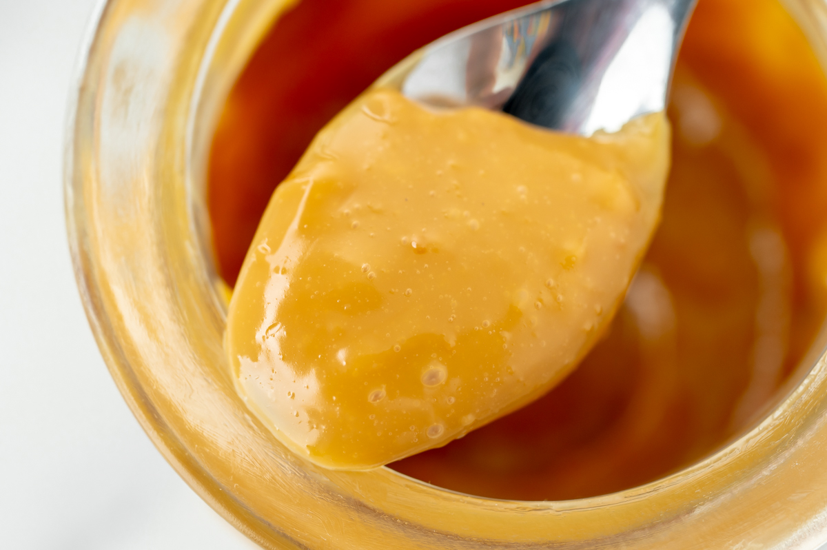 close up shot of spoon full of dulce de leche