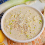 close up angled shot of bowl of creamy leek sauce
