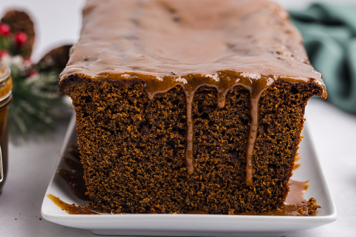 straight on shot of caramel dripping down side of cake