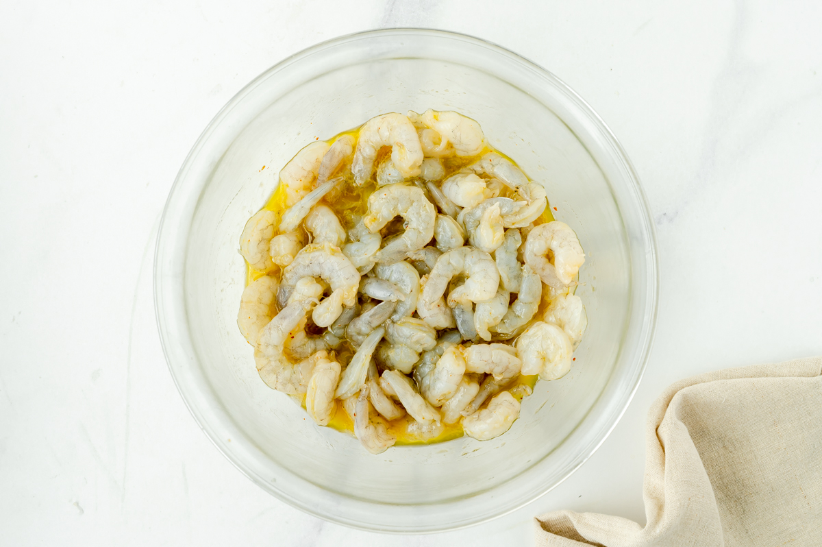 overhead shot of shrimp in bowl of shrimp marinade