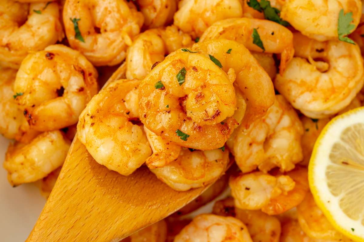 close up overhead shot of shrimp on wooden spoon