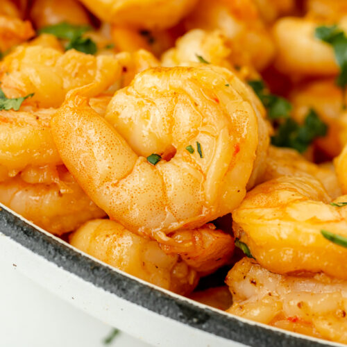 close up angled shot of marinated shrimp in pan