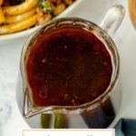 angled shot of udon noodle sauce in jar with text overlay