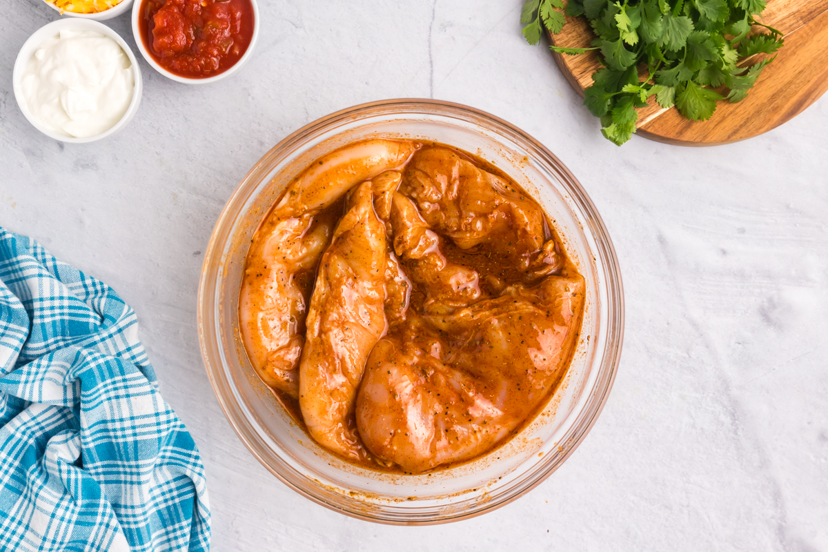 chicken marinating in bowl