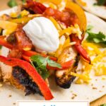 angled shot of chicken fajita with text overlay