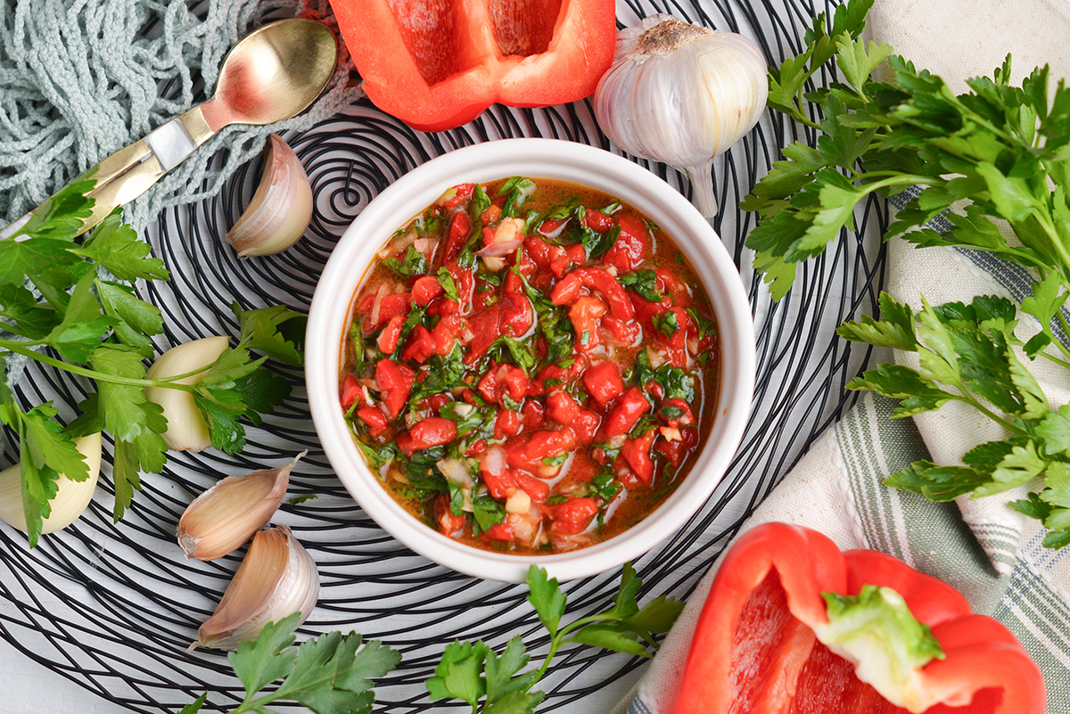 overhead shot of bowl of red chimichurri sauce