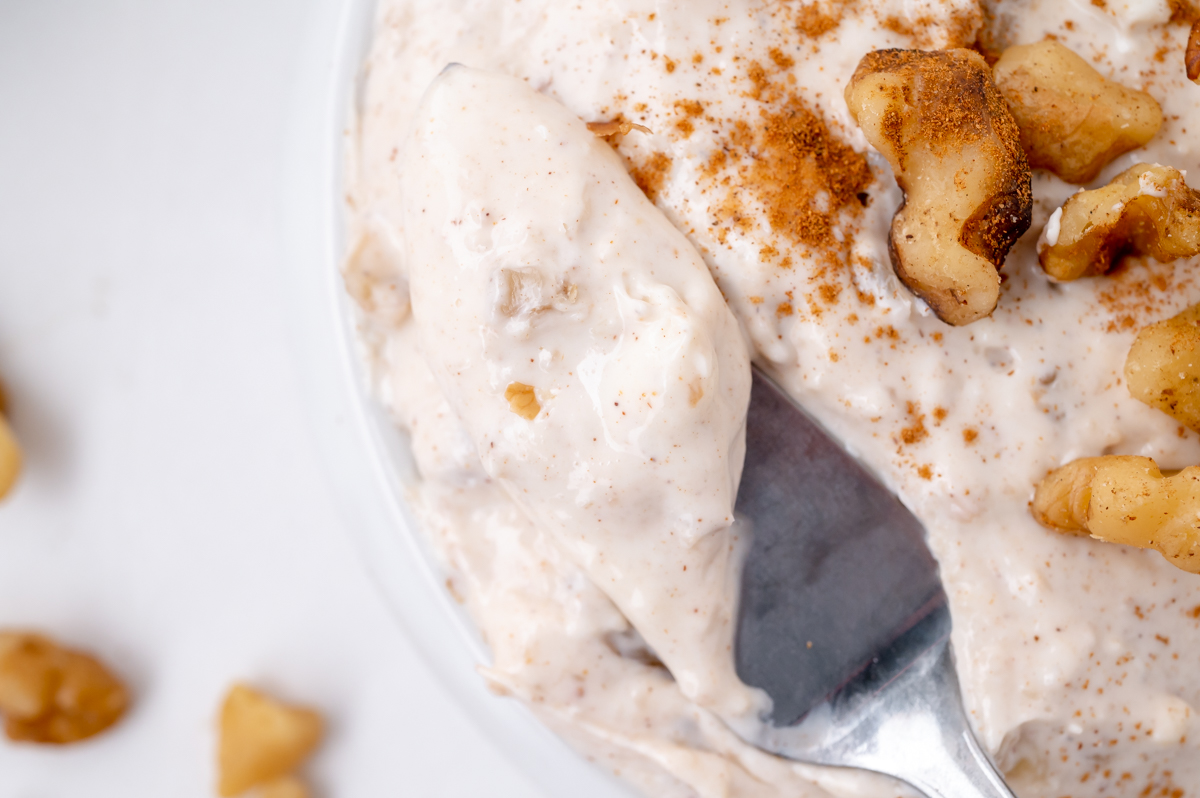close up of honey walnut cream cheese spread on knife