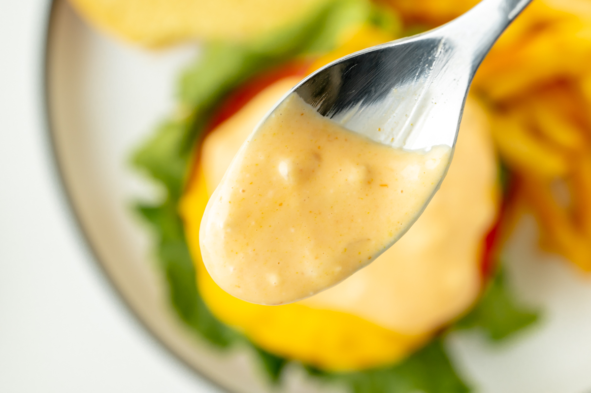 close up of creamy burger sauce on spoon